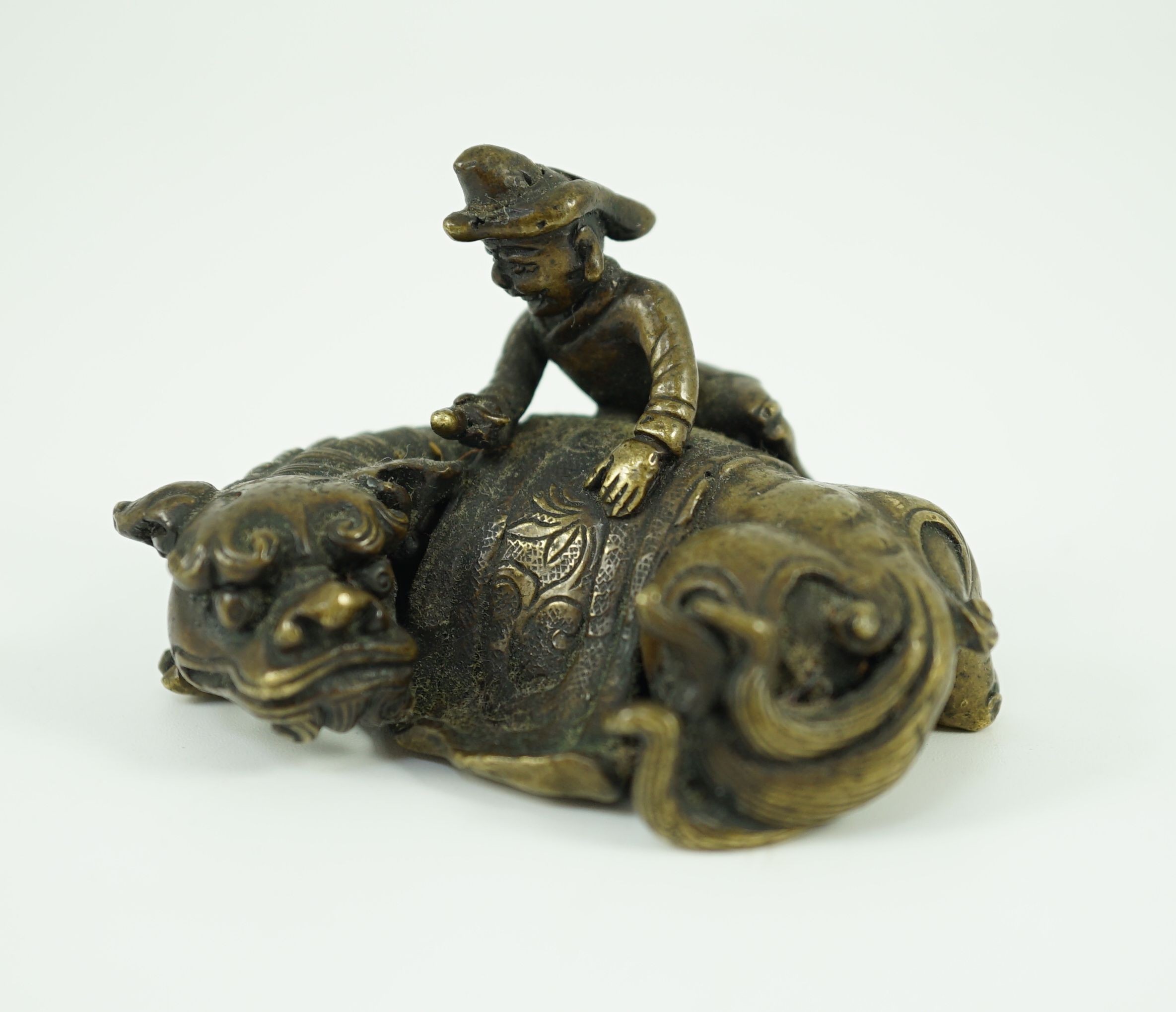 A Chinese bronze ‘Buddhist lion’ scroll weight, 17th/18th century, 6.5cm long